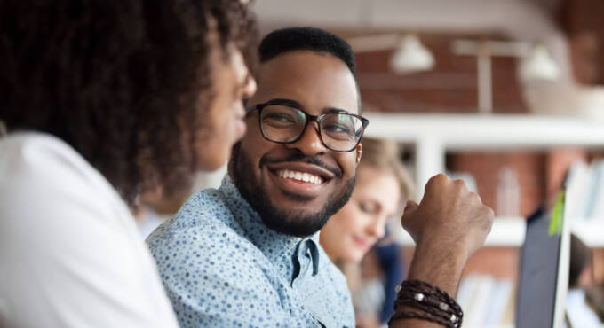 Man smiling at woman