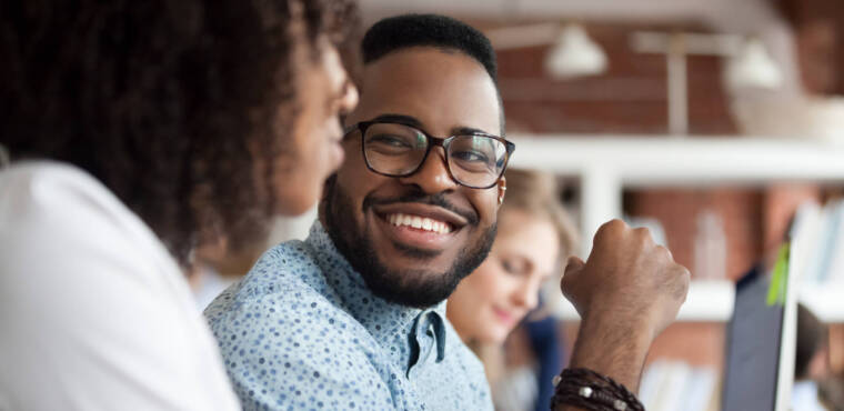 Man smiling at woman