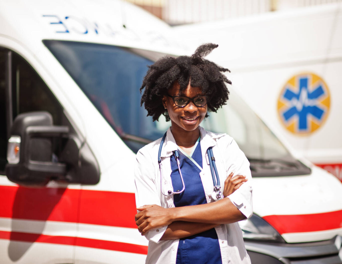 Doctor standing in front of ambulance