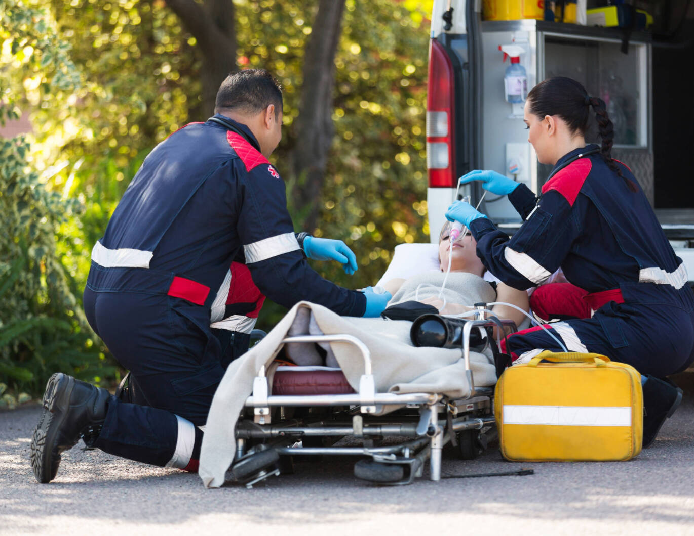 Ems workers treating someone