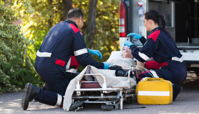 Ems workers treating someone