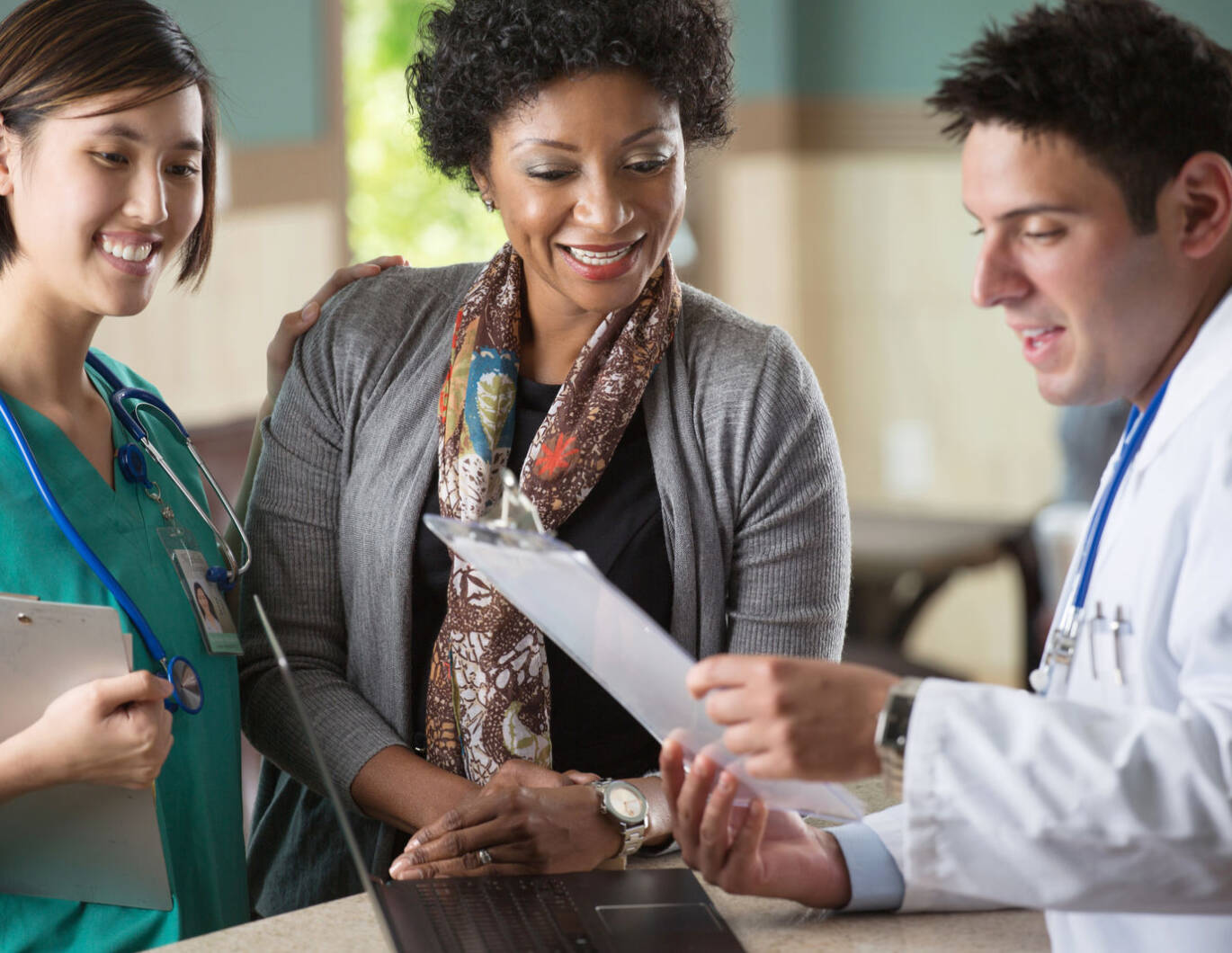 Doctor and Nurse speaking with Patient