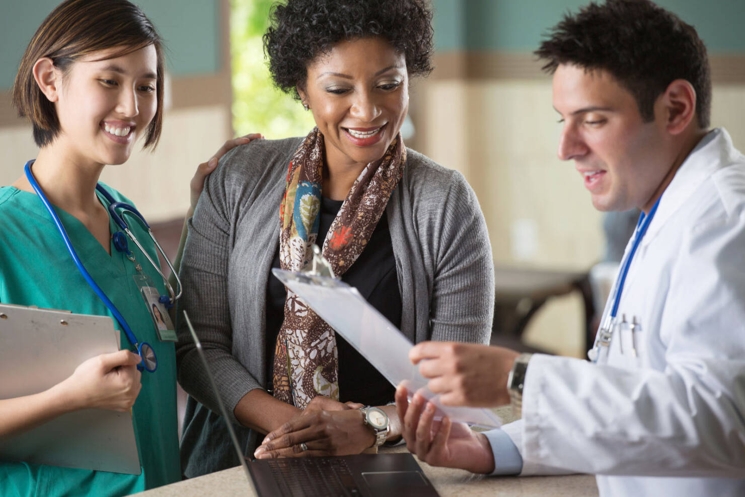 Doctor and Nurse speaking with Patient