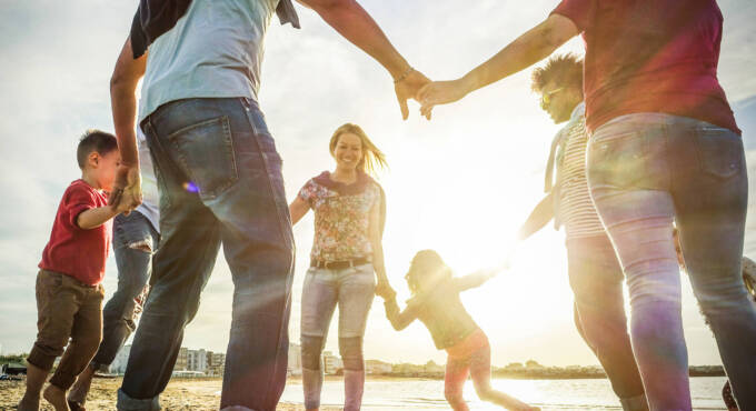 Family playing on the beach