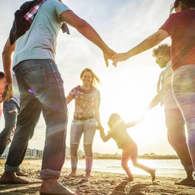 Family playing on the beach