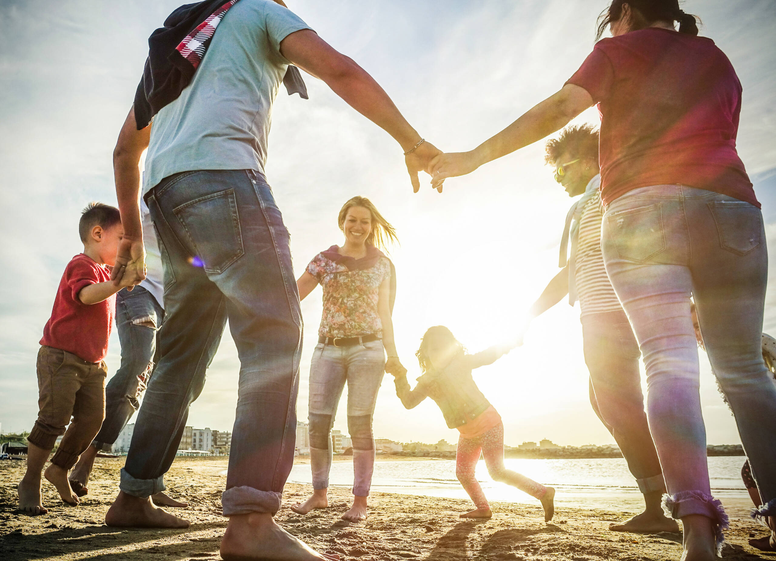 Family playing on the beach