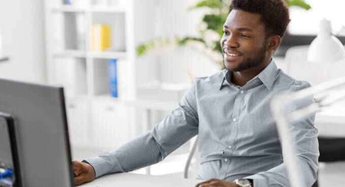 african american businessman with computer working at office